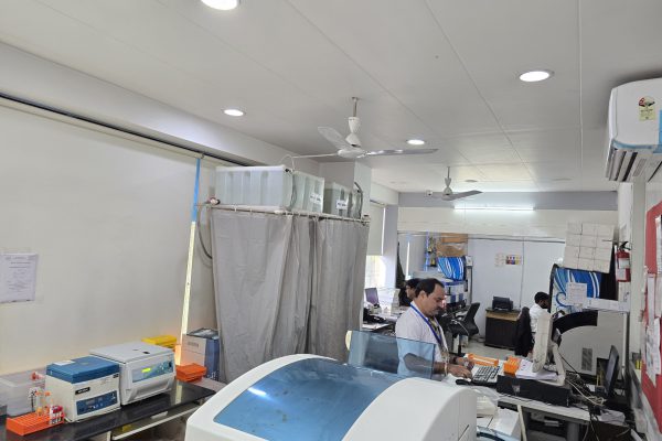 Laboratory area at Arth Diagnostics featuring modern diagnostic equipment and staff working in a clinical environment.