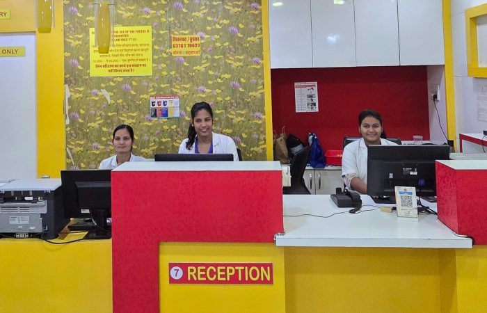 Reception area of Arth Diagnostics with staff seated at the front desk, reflecting a welcoming and professional environment